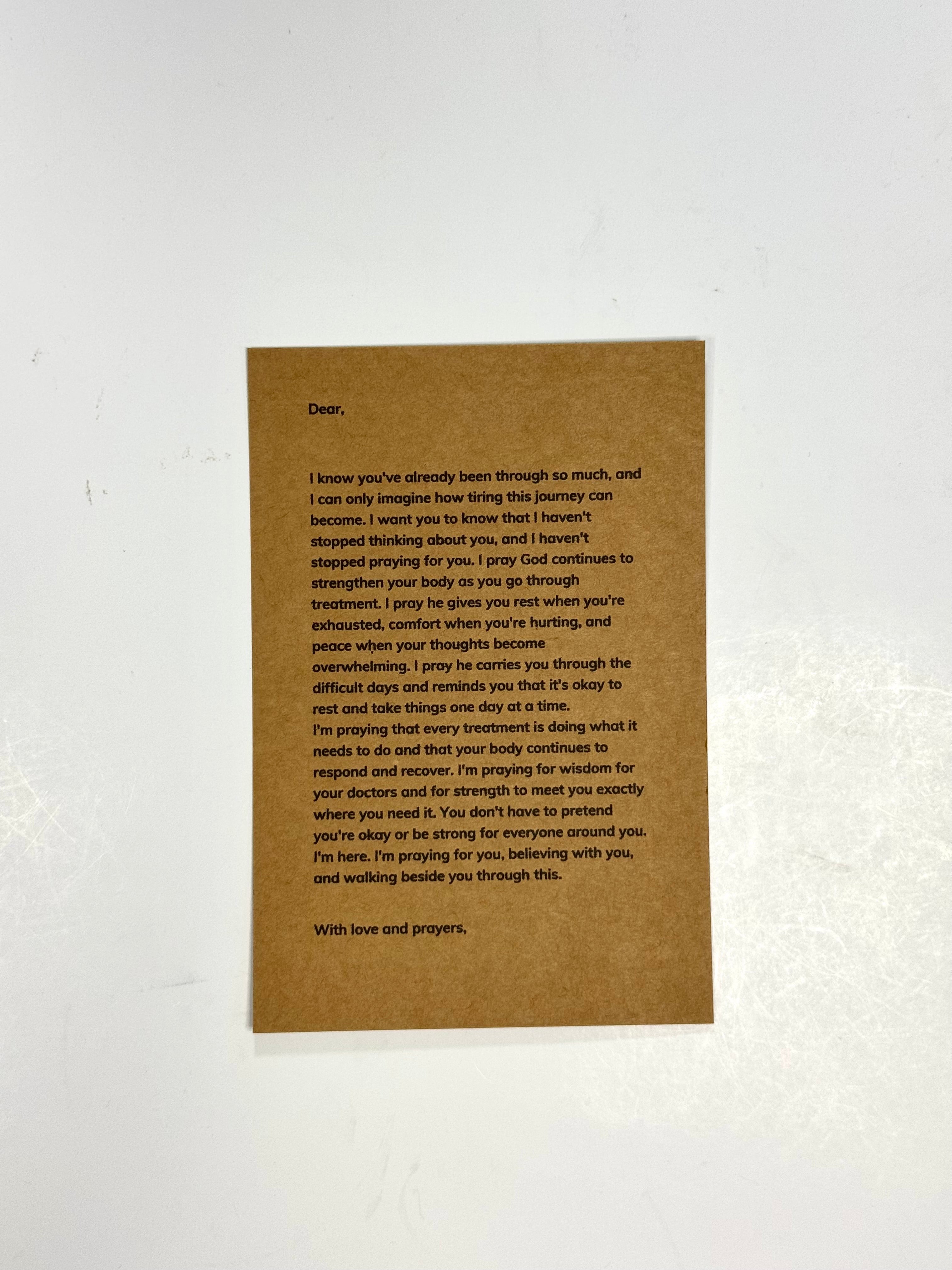 A brown kraft paper card with printed black text, photographed flat against a white background.