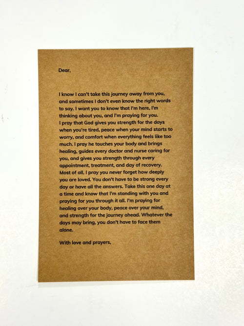 A brown kraft paper card with a handwritten letter printed in black text, photographed against a white background.