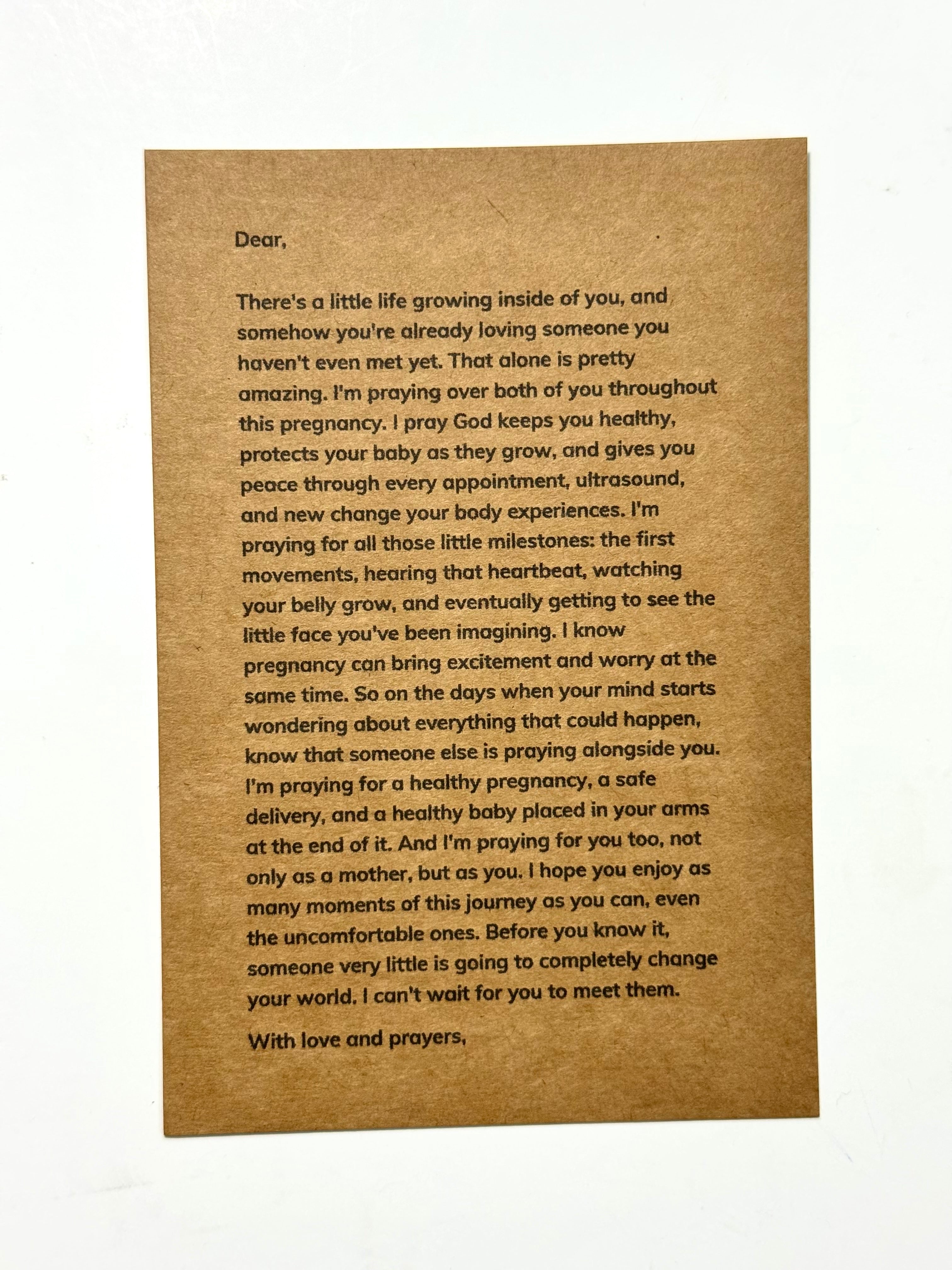 A brown kraft paper card with printed black text, photographed against a plain white background.